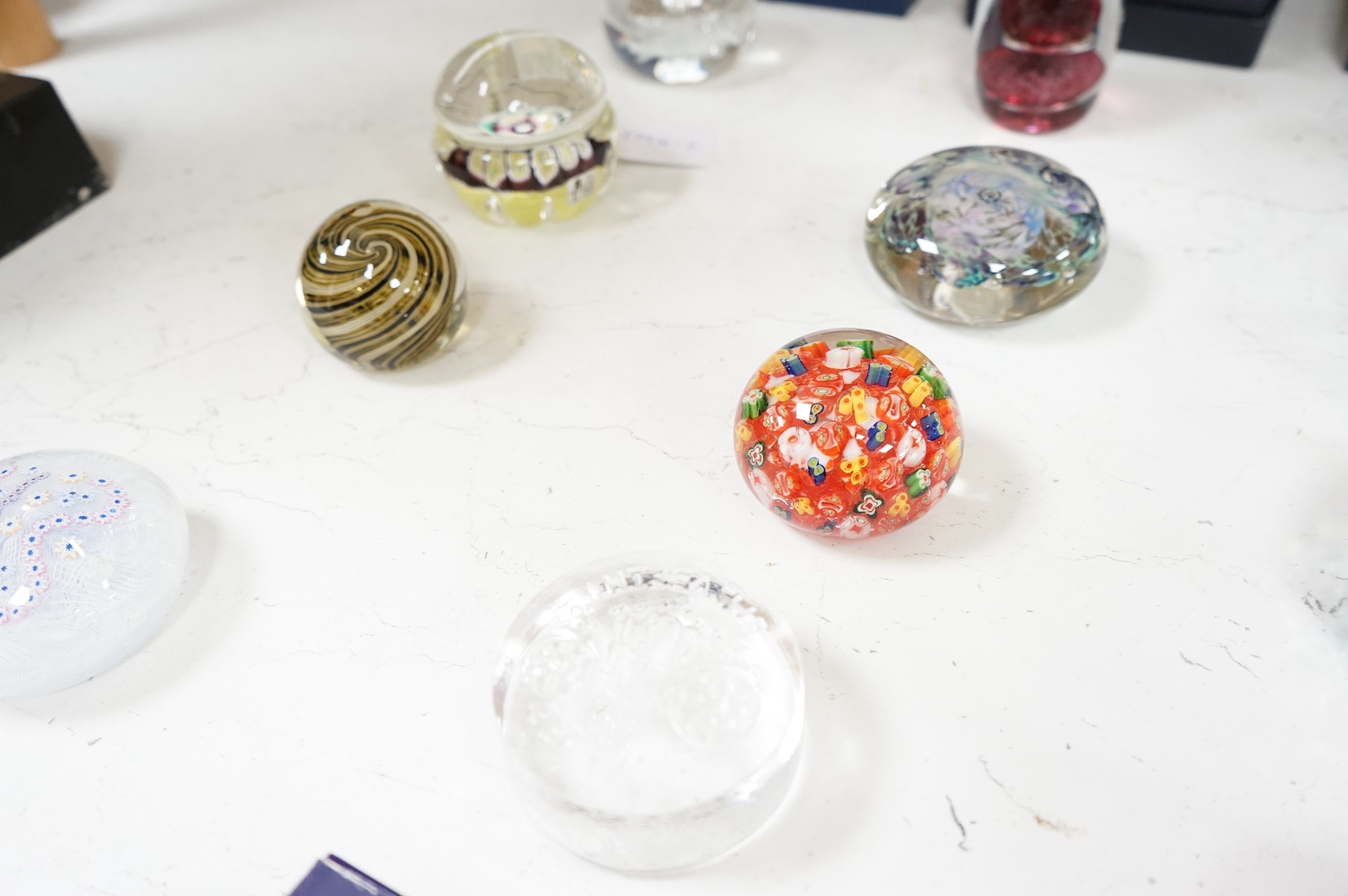 A collection of twenty seven glass paperweights some boxed, to include Caithness and Wedgwood, largest 12cm high. Condition - mostly good